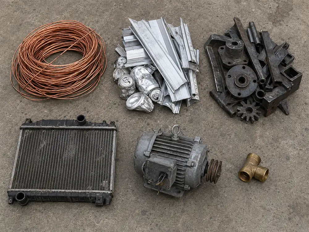 Separated piles of scrap copper, aluminum, steel, brass, a radiator, and an electric motor, showing the range of metals Thornton Iron & Metal buys
That's 145 characters, describes what's actually in th